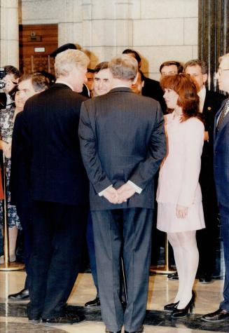 Lucien Bouchard greets Bill Clinton