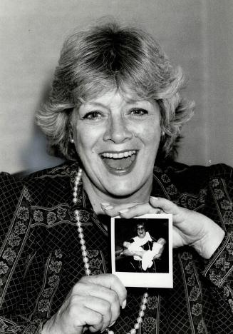 The proud grandmother: Rosemary Clooney's all smiles as she shows photographer a picture of the twins her daughter-in-law Debbie Boone delivered last week