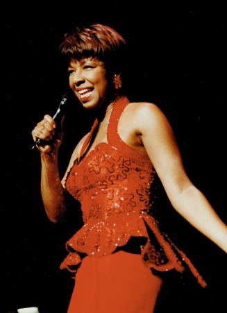 Natalie Cole. Would have looked perfect fronting any band in the 1950s