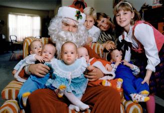 Five times the fun for Santa. The 9-month-old Collier quints (from left, William, Wade, Maxine, Lance and Remington) met Santa for the first time last(...)