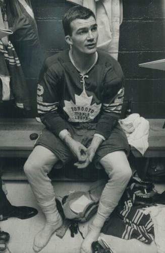 Brian Conacher, stripped of his socks and shinpads, studiously discusses his goal-scoring heroics with reporters in the Leaf dressing room after the game