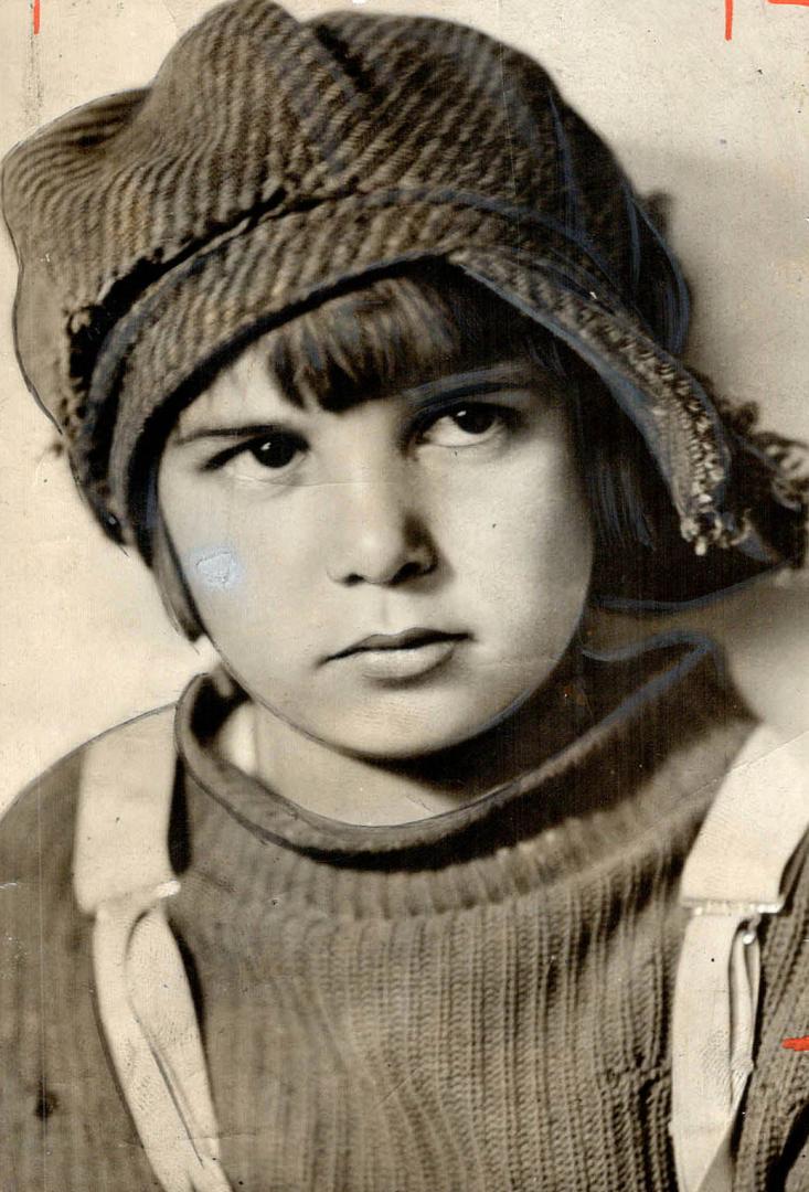 Jackie Coogan at the age of six in his well known peaked cap and sweater