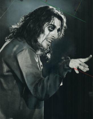 Rock music's oracle of the bizarre, Alice Cooper, brought his nightmare to life with $300,000 worth of props and outlandish makeup at Maple Leaf Garde(...)