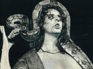 Alice Cooper shows his bizarre side with his 11-foot boa-constrictor