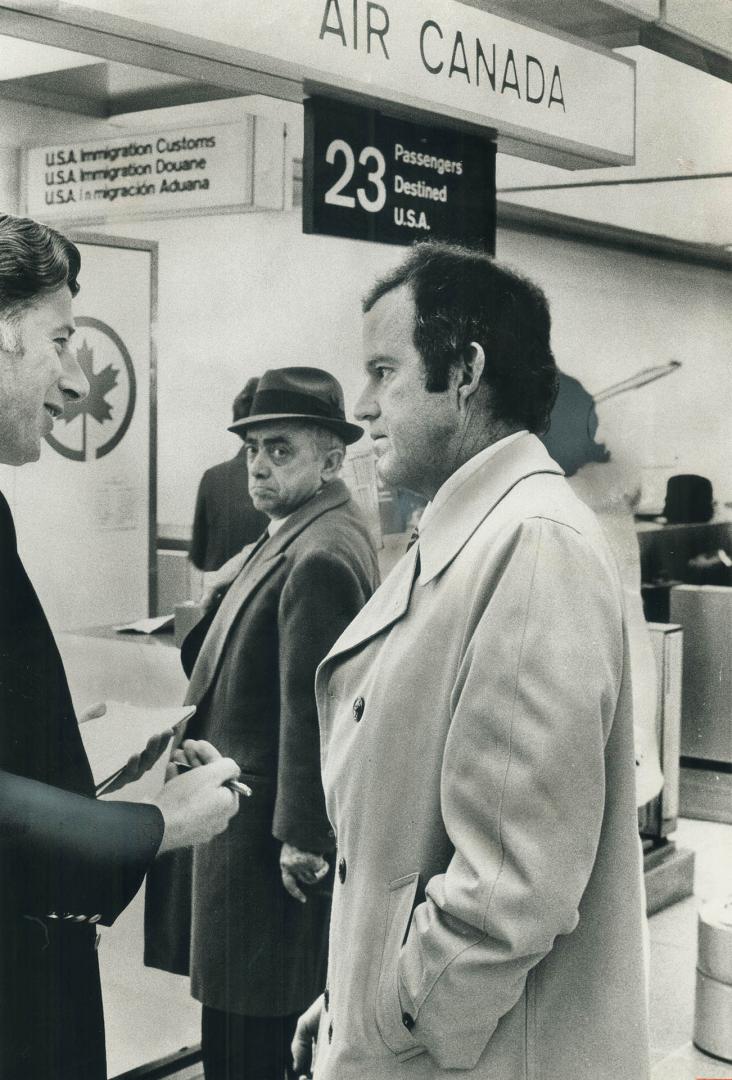 Astronaut Gordon Cooper (right) is interviewed by Star reporter Peter Moon (left) as Cooper's associate Jimmy Neal watches. Cooper was in Toronto this(...)