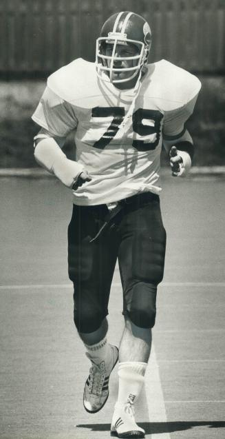 Let's go! Big Jim Corrigall trots onto the practice field at Lamport Stadium yesterday after he signed a contract with Toronto Argonauts that will all(...)