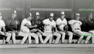 Welcome abroad, Mr. Cone: Blue Jay Rance Mulliniks, centre, shakes the hand of new pitching addition David Cone yesterday in the dugout. Cone makes his debut as a Jay starter today against Brewers