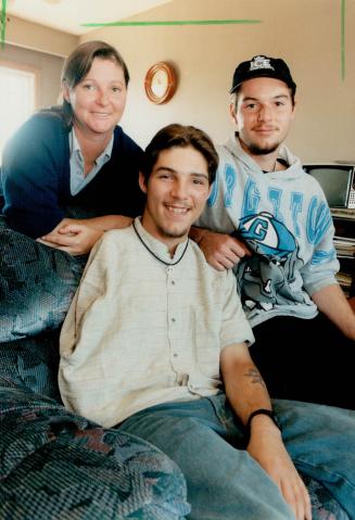 Scott Connor (centre) mother Sandi, brother Adam