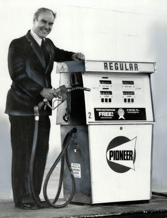Small-Oil lobbyist: Jim Conrad, executive director of the Canadian Federation f Independent Petroleum Marketers, pumps gas at a Pioneer station, one of the independents whose interests he represents