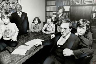Cooper with, from left, Ian, 5, father Sam, Denise, 11, wife Eleanor, Richard, 13, and Jamie, 9