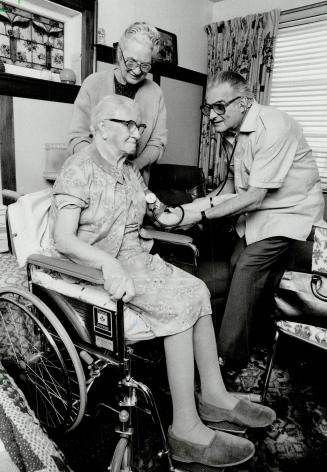 Family doctor: Dr. R. M. Cooper has been a family doctor in East York for 30 years, and Evelyn Waterson feels his almost weekly visits are the reason why her mother, Annie Waterson, can live at home