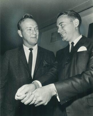 Champ gives Arnie tips. Gary Cowan of Kitchener, new U.S. amateur golf champion, shows grip to greatest money-winning pro, Arnold Palmer. Arnie will pass up their year's Canadian Open