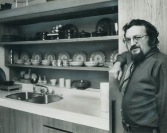 Architect Harvey Cowan stands in a kitchen--his own--whose design is as up-to-date as our modern appliances