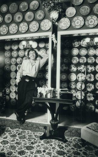 Decorative plates: A variety of antique plates, plus some he painted himself, are dramatically displayed in the den of artist and champion figure skater Toller Cranston