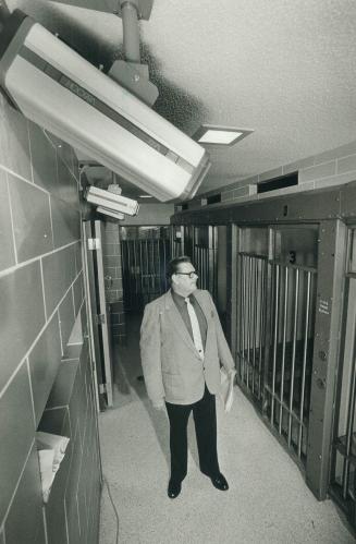 In the jailhouse now: Acting Superintendent James Crawford inspects the jail cell area corridor where new video cameras have been installed in order to keep a closer watch on prisoners