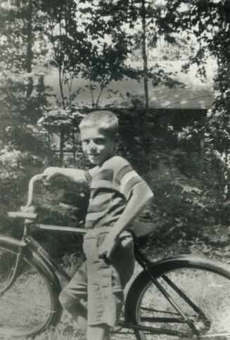 Typical kid of the '50s, Gordon Cressy poses with his bike