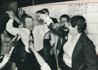 David Crombie celebrates the thrill of victory with his wife Shirley and joyful Tory supporters