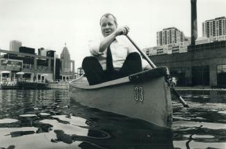 Waterfront vision: David Crombie does a little canoeing in the Harbourfront pool after releasing his report yesterday