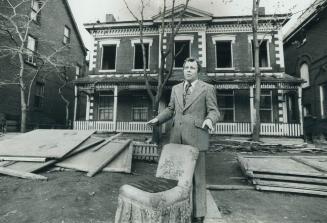 Mayor David Crombie stands in front of one of 25 houses in the Sherbourne-Dundas Sts