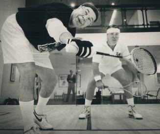 CFL commissioner Donald Crump, left, does battle with Argonauts head coach Don Matthews on the squash court yesterday at the SkyDome fitness club. Cru(...)