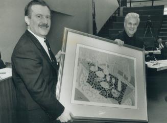 Celebrity at city hall. Actor Tony Curtis, visiting Toronto City Hall yesterday, presents one of his paintings, Breakfast At Bel Air, to Metro Chairma(...)