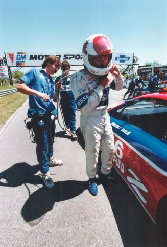 Takes two: Toronto's Jeremy Dale gets help from a Nissan technician before strapping on his turbo charged sports car at last year's Mosport race