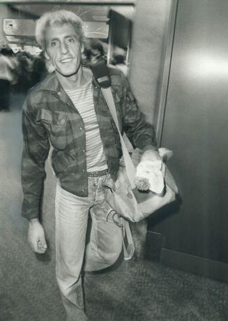 Last show: Singer Roger Daltrey arrived smiling at Toronto international Airport last night geared up for The Who's farewell Toronto performance
