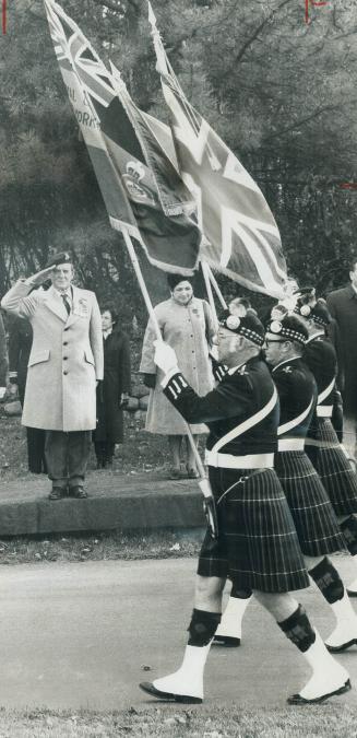 Danson takes salute. Defence Minister Barney Danson takes salute at march-past of Royal Canadian Legion Pipe Band from North York Branch No. 66 at Rem(...)