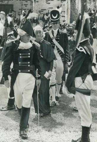 East York Mayor True Davidson, wearing a long green gown supposedly symbolizing the Spirit of the Don, walks beside Major Michael Stevenson (left), of(...)