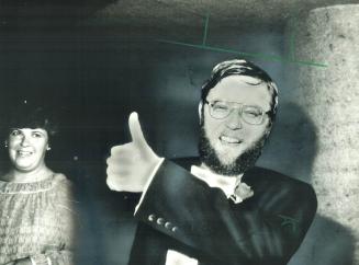 Let's go! Conductor Andrew Davis gave the thumbs up sign as he entered Roy Thomson Hall last night to put the Toronto Symphony through its first concert in its new home
