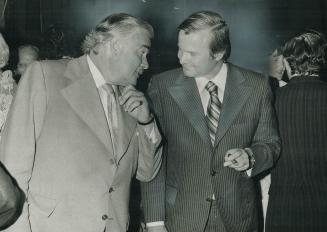 Former premier John Robarts talks with Premier William Davis at a testimonial dinner for Robarts last night at the Royal York given by the City of Tor(...)