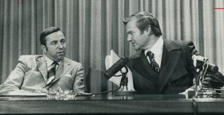 Ontario treasurer Darcy McKeough and Premier William Davis (right) answer questions about a report on foreign investment prepared by a provincial gove(...)