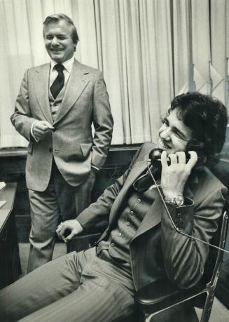 Honorary premier George Allain, 18, of Brampton takes care of business while Premier William Davis smiles in the background of his office. Allain, nam(...)