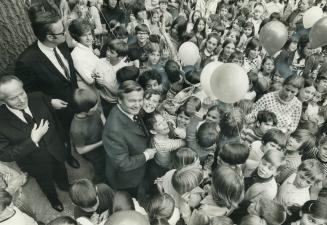 Surrounded by children and balloons, Premier William Davis tours the new $78,000 Toronto French School o Mildenhall Rd