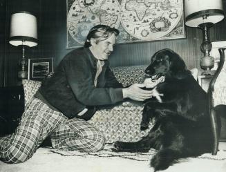 Ontario Premier Williams Davis relaxes at his Brampton home with his dog Thor, a 1 1/2-year-old mixture of Labrador and collie that he bought at an au(...)