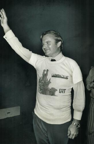 At the CNE bandshell Premier William Davis wears gift T-shirt he was given by Skip Prokop, of the rock group Lighthouse, after Davis had presented him(...)