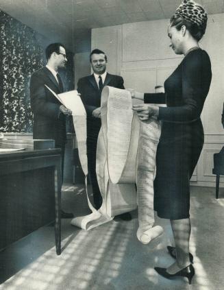 Twenty-foot Scroll against Protestant-slanted religious education is presented today to Education Minister William Davis by Rev. Arnold Thaw of South (...)