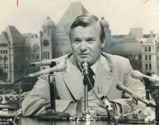 Recalling the Legislature to end Metro's 19-day-old transit strike, Premier William Davis sits in front of a mural of Queen's Park. The bill ordering (...)