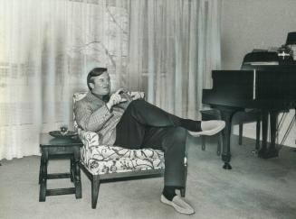 Taking it easy, before he moves into the job of Ontario premier, William Davis relaxes at his home over the weekend