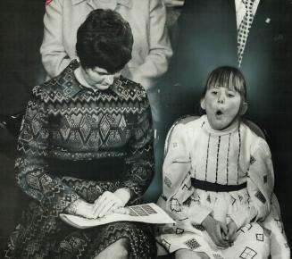 Throne speeches are for adults to worry about, Premier William Davis's young daughter Meg became interested in other things. Her mother (left) follows(...)