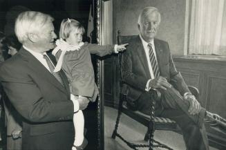 Hanging around Queen's Park. William Davis lifts granddaughter Kathleen, 3, for a better look at a portrait of him by artist Istvan Nyikos that was un(...)