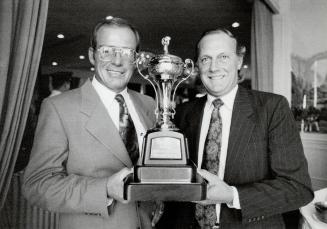 Who will win it? Trainers Jim Day (left, Sky Classic) and Roger Atfield (Izvestia) hold the Rothmans International trophy their colts will chase Oct. 20