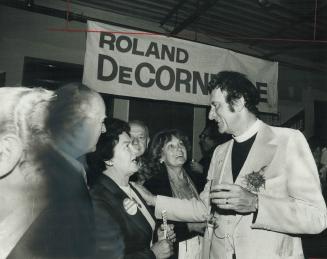 Tory unseated. Wine and tears of relief flowed at Liberal MP Rev. Roland de Corneille's headquarters when his Troy rival Rob Parker conceded the fight(...)