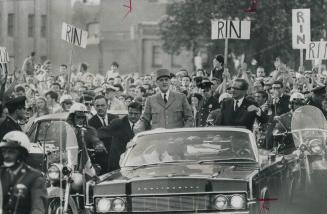 Triumphant ride by Le Grand Homme, French President Charles de Gaulle (left) through cheering crowds by the side of Premier Daniel Johnson has left a (...)