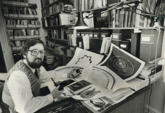 Surrounded by his astrology equipment, radio journalist Malcolm Dean predicts that one day psychologists will routinely use astrology charts in treating their patients