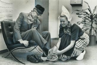 The mayor was a shoe-in. Mayor William Dennison gets Dutch wooden shoes fitted by Karen Van Der Lingen as part of a three-day festival to promote Neth(...)