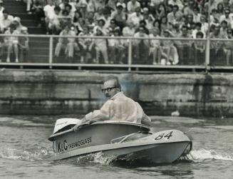 Look out! . . . here comes the mayor. Off to sea in a tub, Toronto's Mayor William Dennison surveys his progress with some dismay as his motorized bat(...)