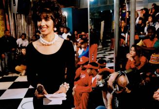 Curls and pearls: Electric Circus host Monika Deol in pearls and the little black dress from B-Scene, which supplies her wardrobe for the show