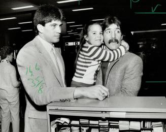 A parting hug: Leafs' Bill Derlago gets hug from daughter Amanda, 4, before leaving for Europe to play for Team Canada