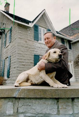 Taking a break: Retiring Chief Justice Brian Dickson and his dog Derry relax at the family farm near Ottawa